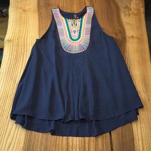 Blue drapey top with embroidered detail.